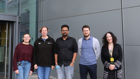 Photo of the Genomics Team in front of the JCBC 