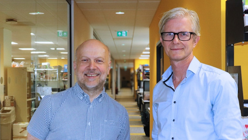 Photo of Bertie Gottgens and Matthias Zilbauer standing in front of the labs