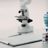 Image in a lab of a microscope and blood samples 